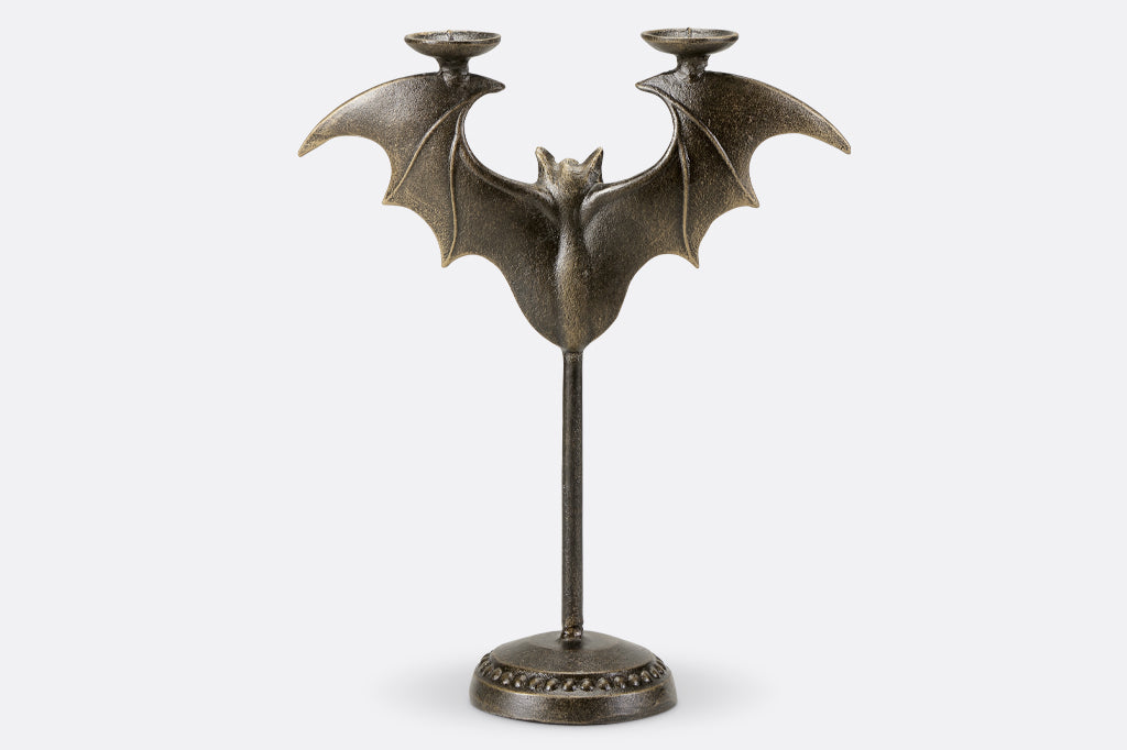 Cast metal bat tapper candle holder, back view