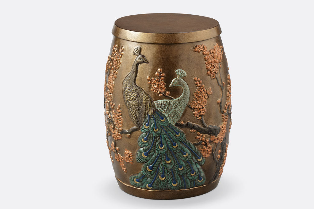 Cast Aluminum stool with storage space inside features two peacocks entwined among flowering blossoms