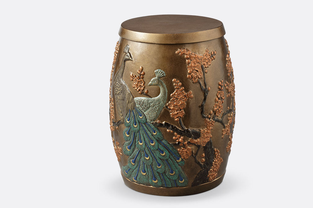 Cast Aluminum stool with storage space inside features two peacocks entwined among flowering blossoms