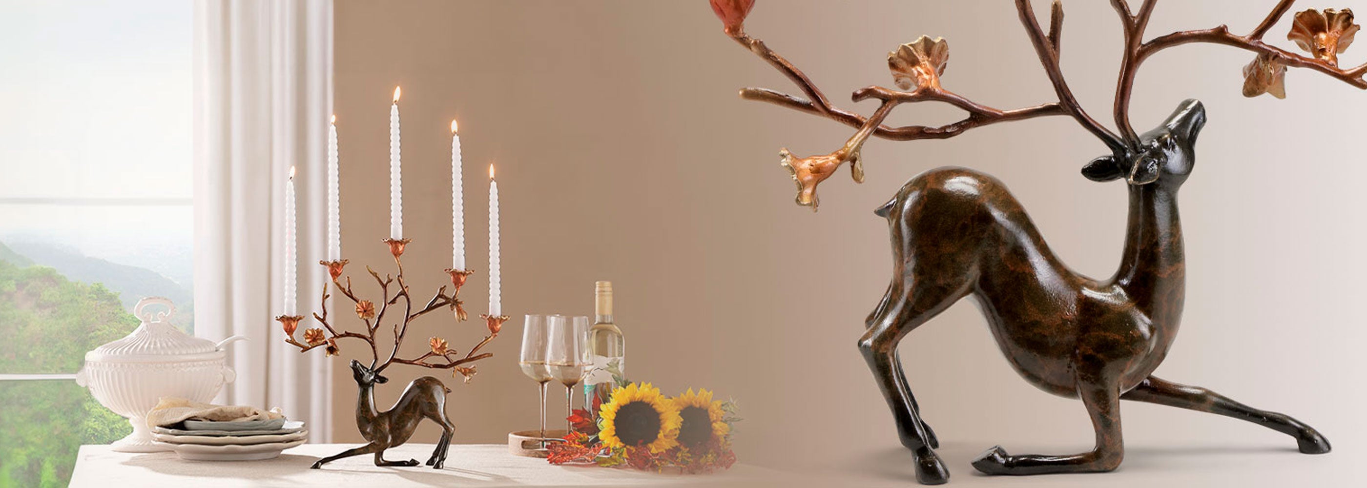 two views of a stag shaped candleholder with tapers in its antlers; far away shot of dining table, and closeup view