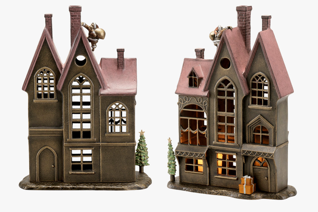 back and front views of Up on the Rooftop Candle House candleholder with removeable santa, tree, and present accessories