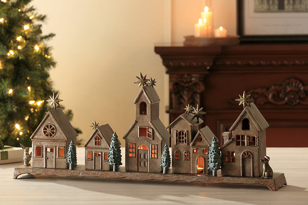 Cast metal holiday village house set of five, with small whimsical animals on side 