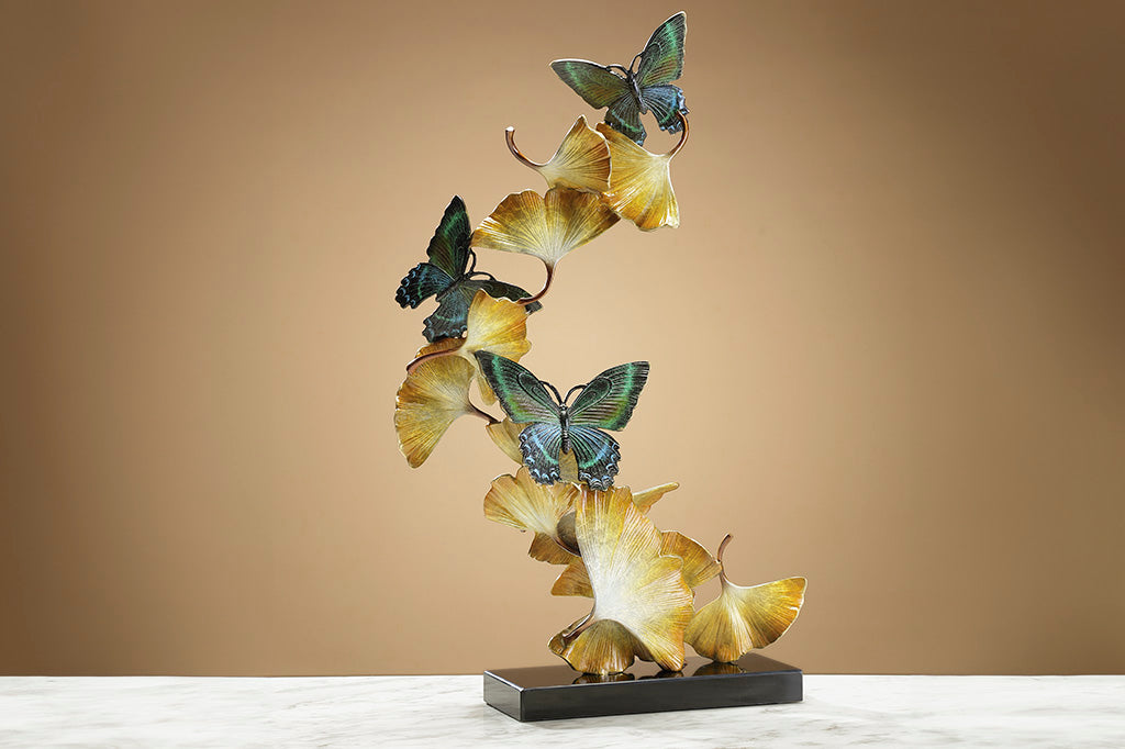 Limited Edition sculpture features fluttering ginkgo leaves and exquisitely finished butterflies, spiraling upwards from a marble base