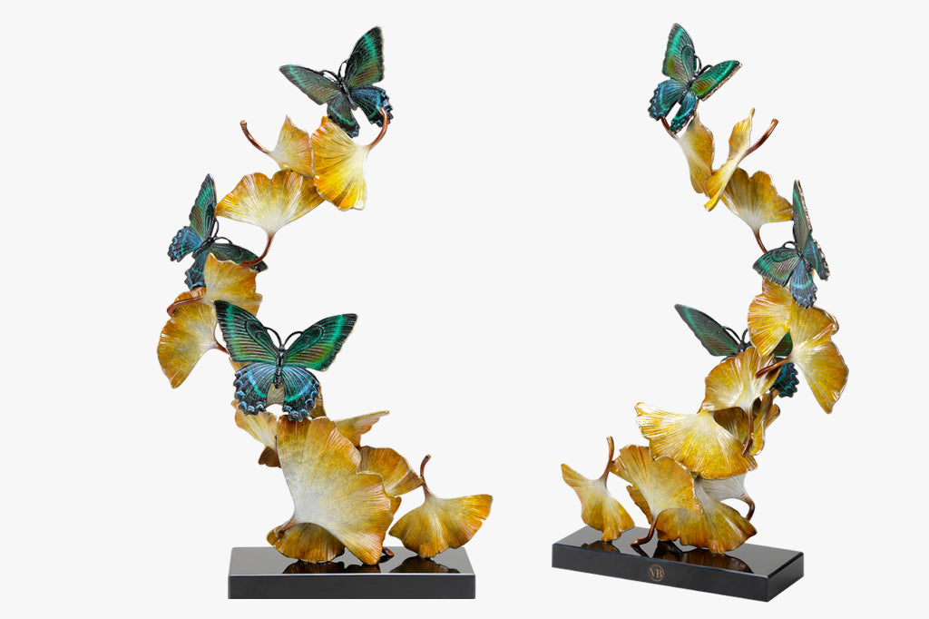 Limited Edition sculpture features fluttering ginkgo leaves and exquisitely finished butterflies, spiraling upwards from a marble base. Two shown side by side, front and back