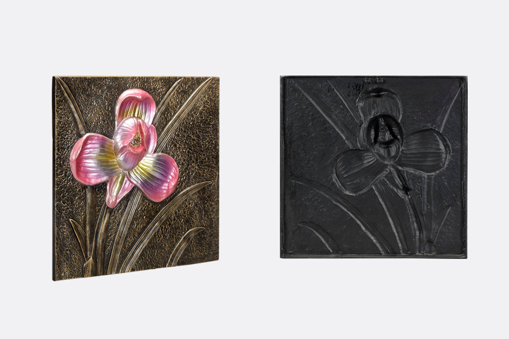 Bronze decorative wall tile with metallic pink/violet orchid motif- side view and back view