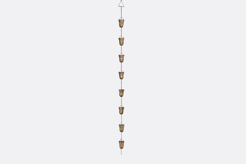 A rain chain with 8 cups decorated with pine cone motifs.