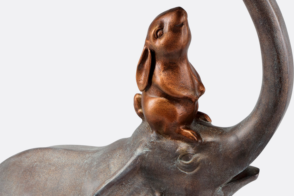 closeup detail of copper/bronze finish on the rabbit who sits on elephant's head