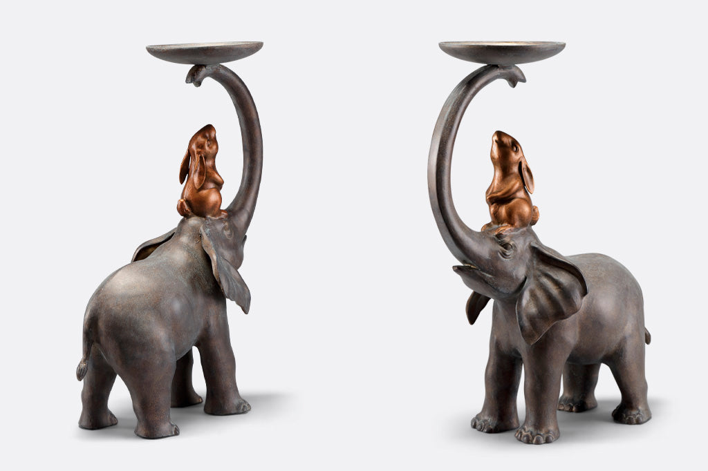 alternate views of Garden Sculpture Plant Stand shows rabbit sitting on elephant's head, whose trunk holds a plant tray