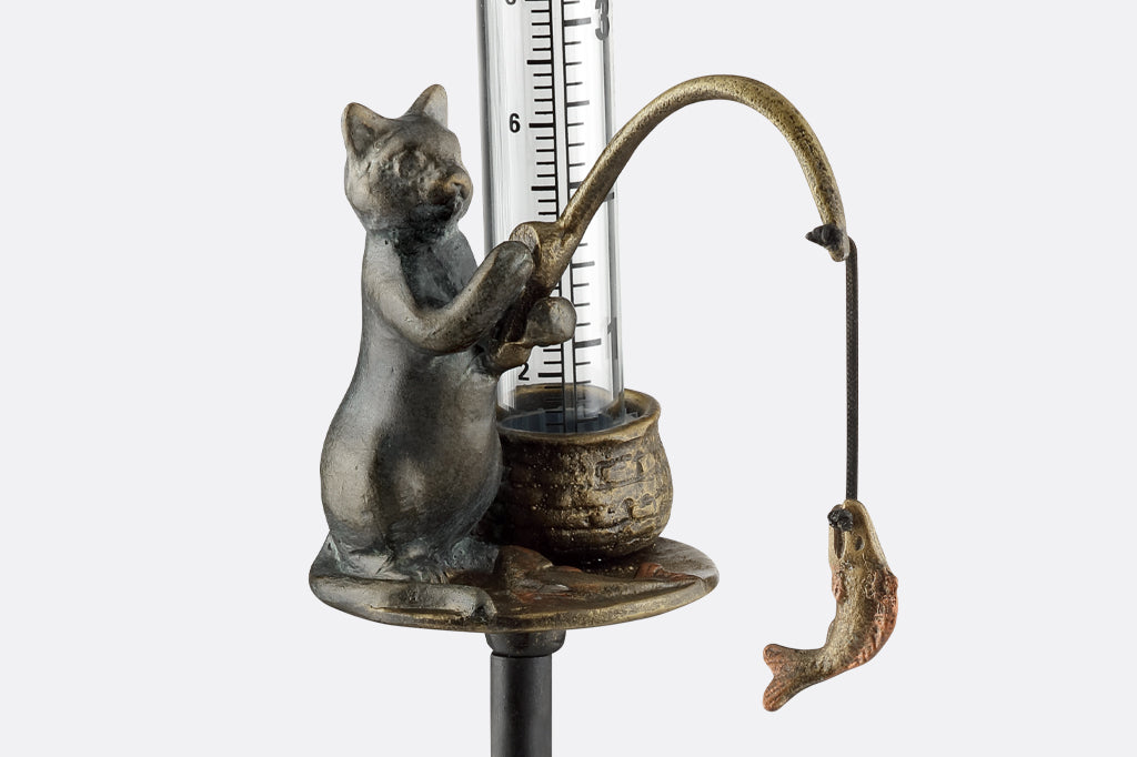 detailed view of cat fishing cast metal rain catcher 