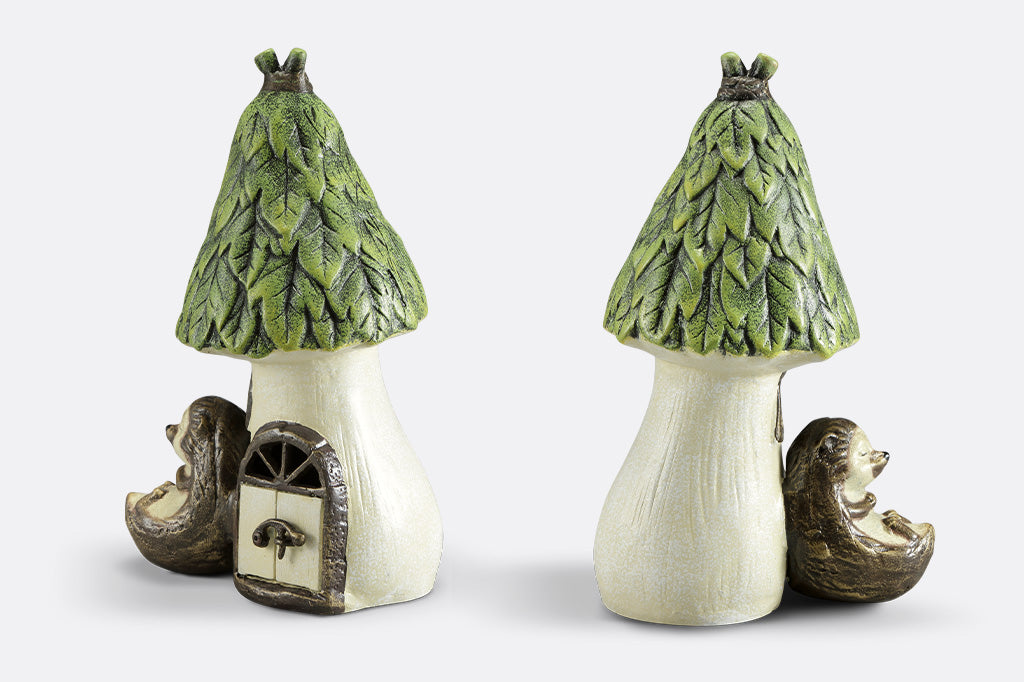 Outdoor Garden candle lantern shows hedgehog sleeping against a woodland house with working door, used to insert votive candle. Side and back views.