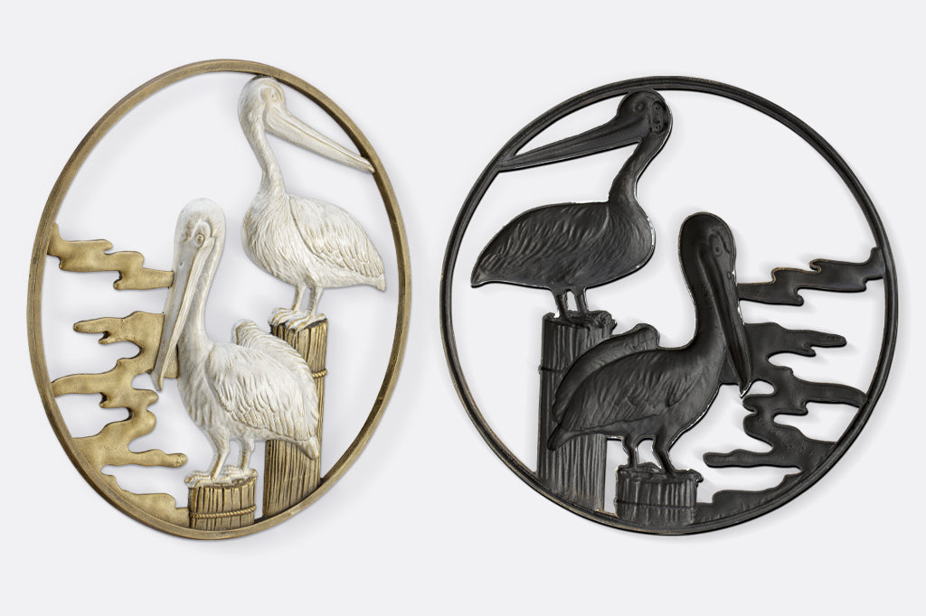 close up of back of wall decor and hanging mechanism, side view to see raised design of pelican wings 