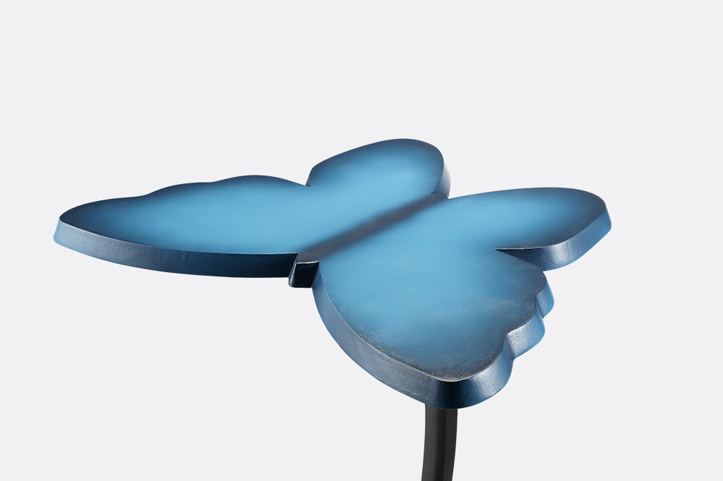 modern blue accent table with butterfly silhouette