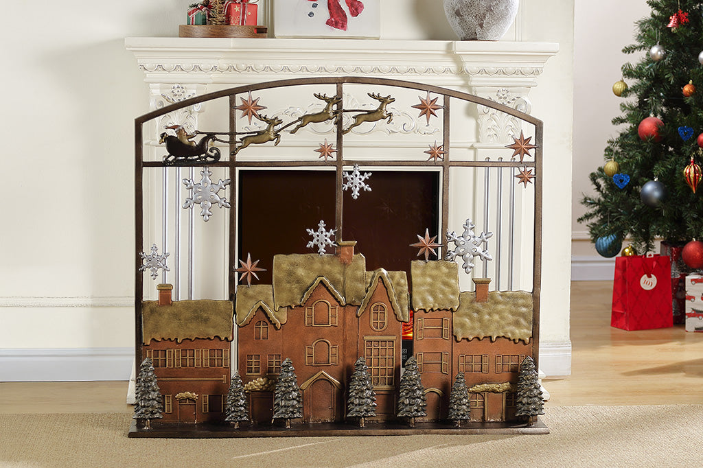 Decorative fireplace screen with Christmas village design in a living room setting.