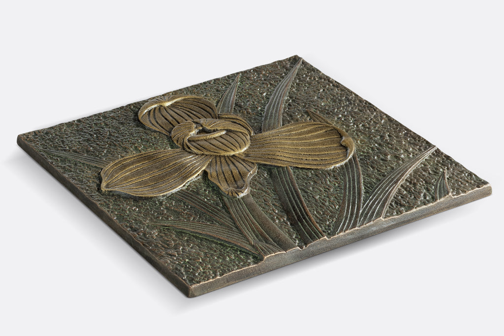 side view of orchid stepping stone, slight raised design of orchid flower 