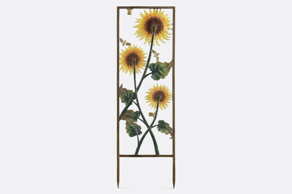 back of sunflower and bee trellis, the back of the flowers and stem is reflected on back of trellis 
