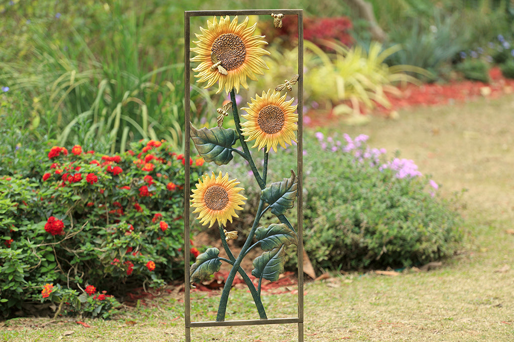 sunflower and bees cast metal trellis set in garden 