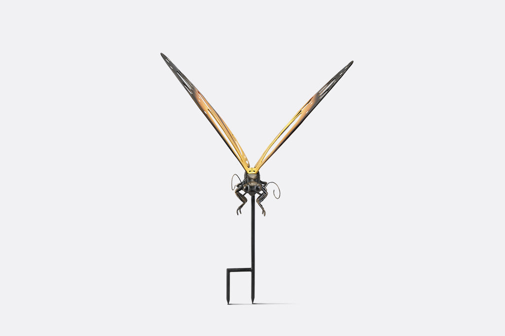 A garden stake of a monarch butterfly.