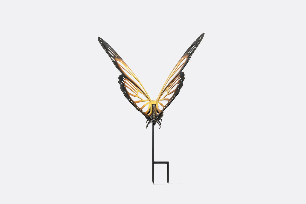 A garden stake of a monarch butterfly.