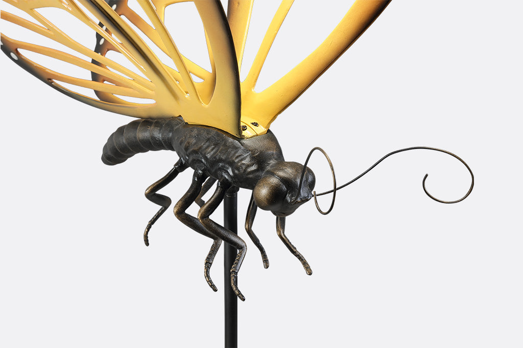 A garden stake of a monarch butterfly.