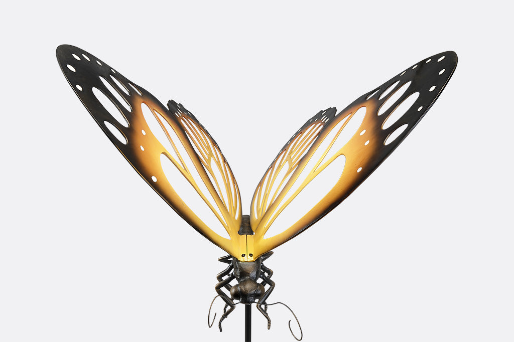 A garden stake of a monarch butterfly.