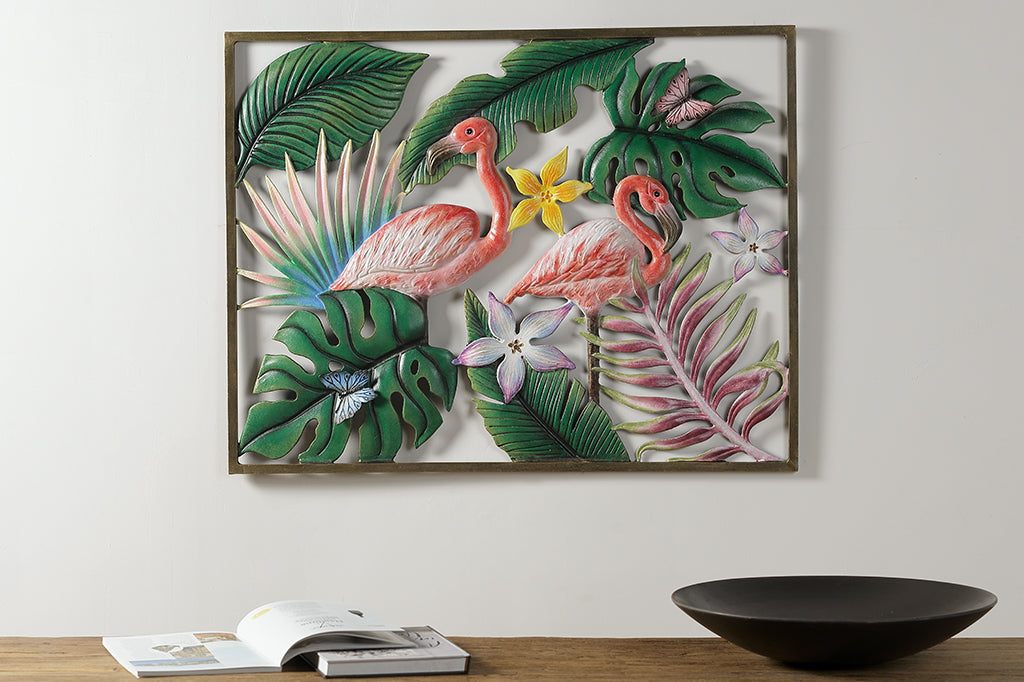 cast metal flamingo and tropical leaves wall plaque set on wall above console table 