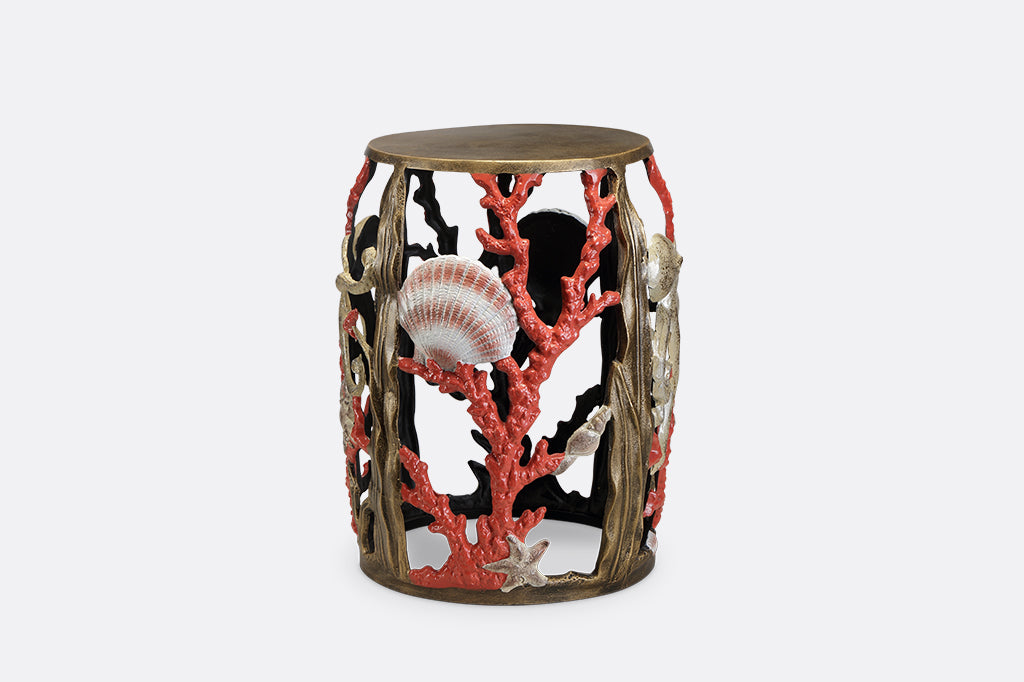Garden stool featuring pink corals, an octopus, seashells, and crabs.