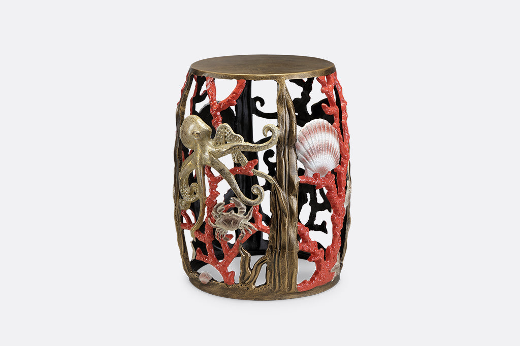 Garden stool featuring pink corals, an octopus, seashells, and crabs.