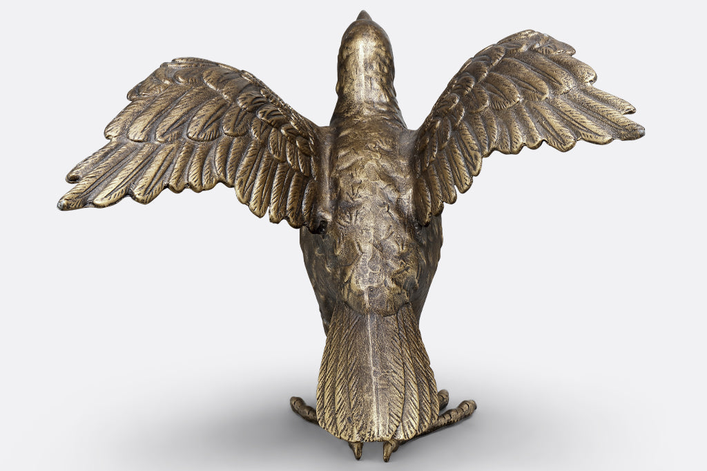 cast metal crow sculpture face back, detailed feathers and wing span 