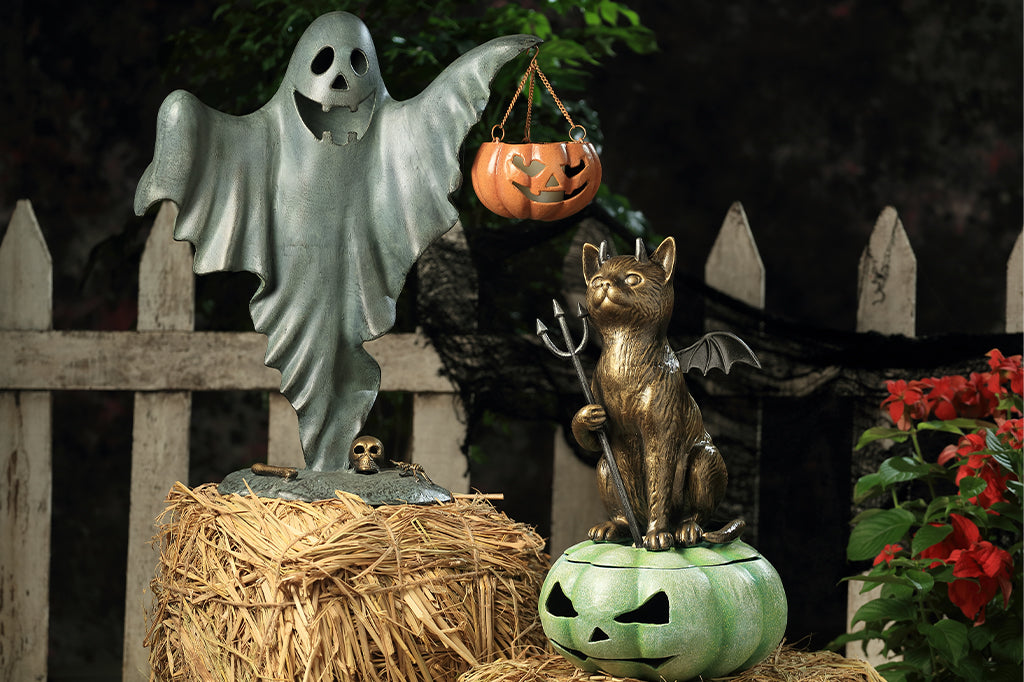 ghost sculpture and devil cat sculpture 