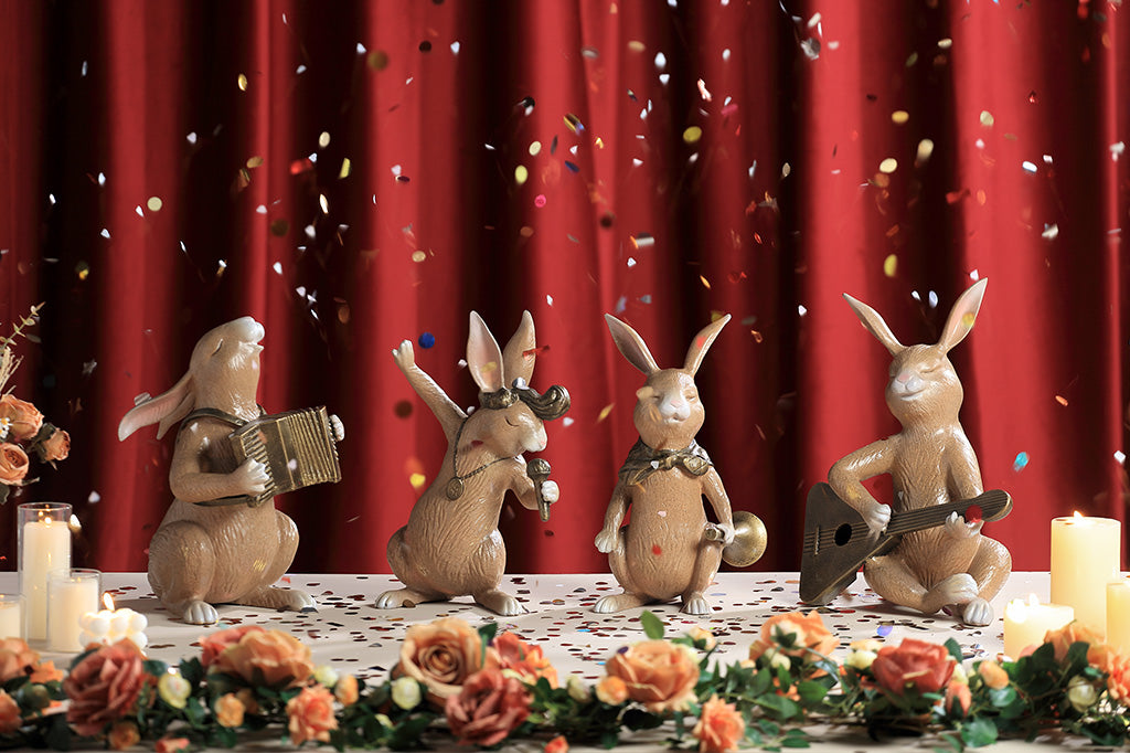 A set of four bunnies performing with musical instruments.