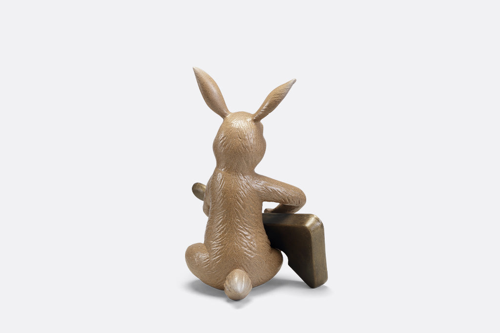 Sculpture of a bunny playing a guitar.