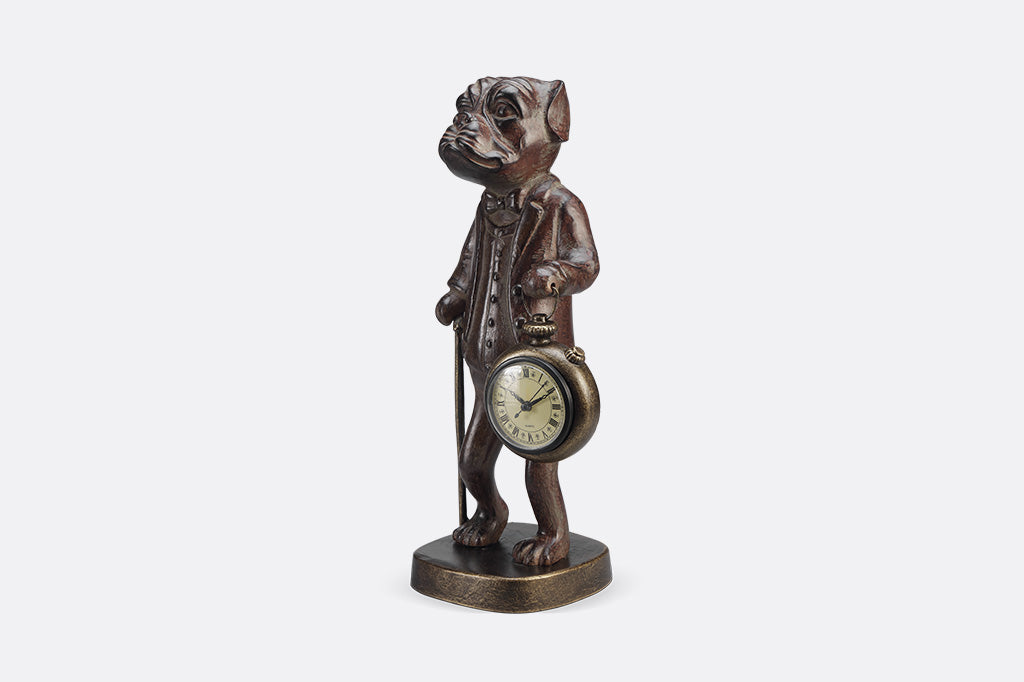 Bronze statue of a dog with a pocket watch on a white background