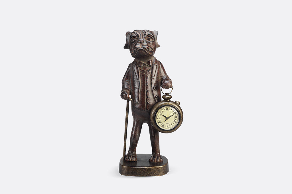 Bronze statue of a dog with a pocket watch on a white background