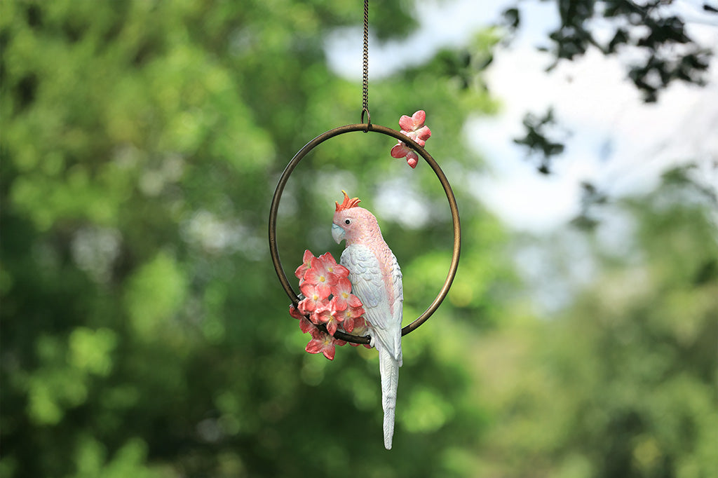 Decorative hanging sculpture with a bird and flowers