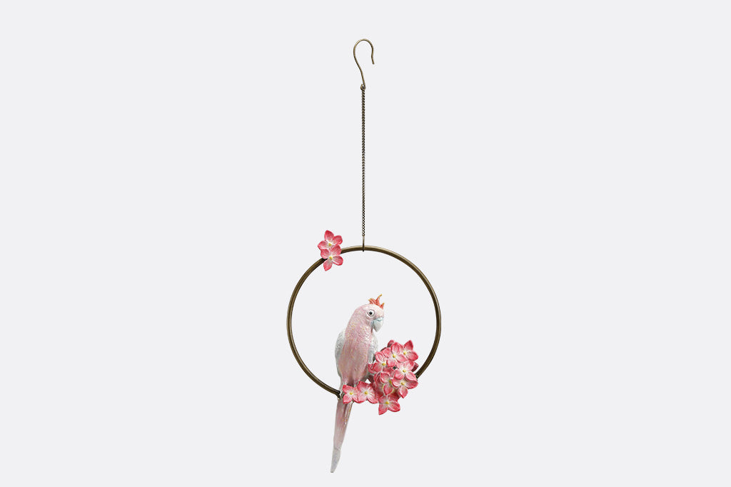 Decorative hanging sculpture with a bird and flowers