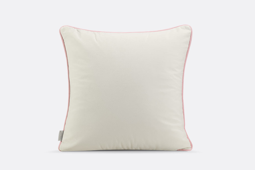 Green pillow with pink floral pattern