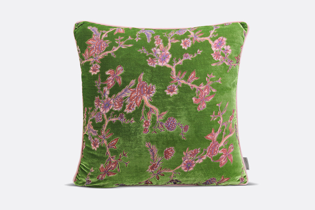 Green pillow with pink floral pattern
