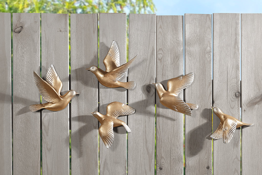 A set of 5 gold birds posed in flight.