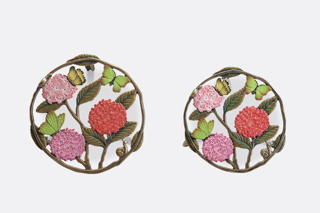 A set of 2 plant stands featuring details of pink hydrangeas, leaves, snails, and butterflies.