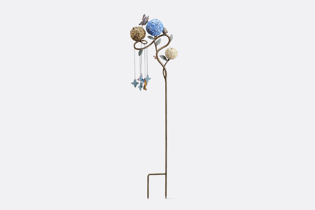 Decorative garden stake with butterflies shot on white background, front view.