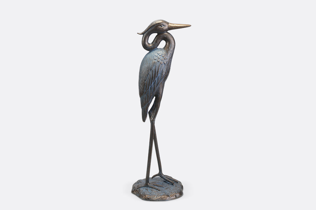 A sculpture of a heron with an arched neck.