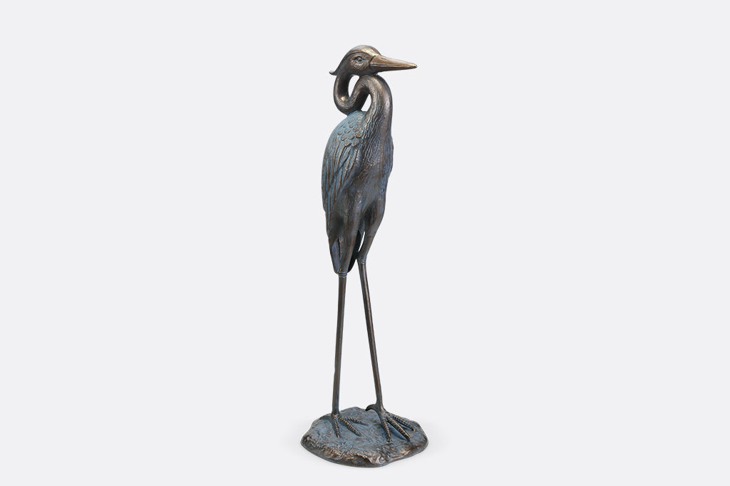 A sculpture of a heron with an arched neck.