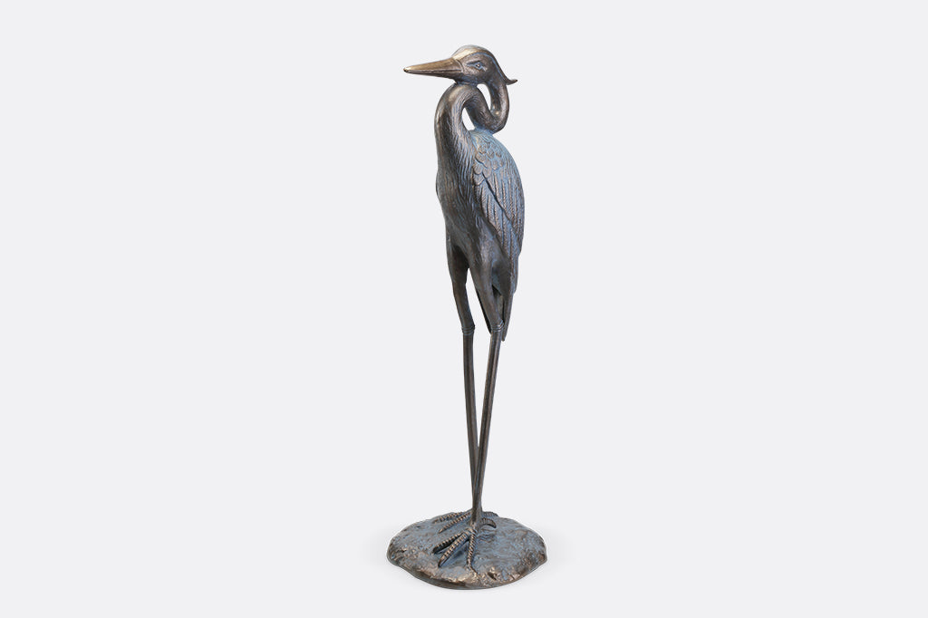 A sculpture of a heron with an arched neck.