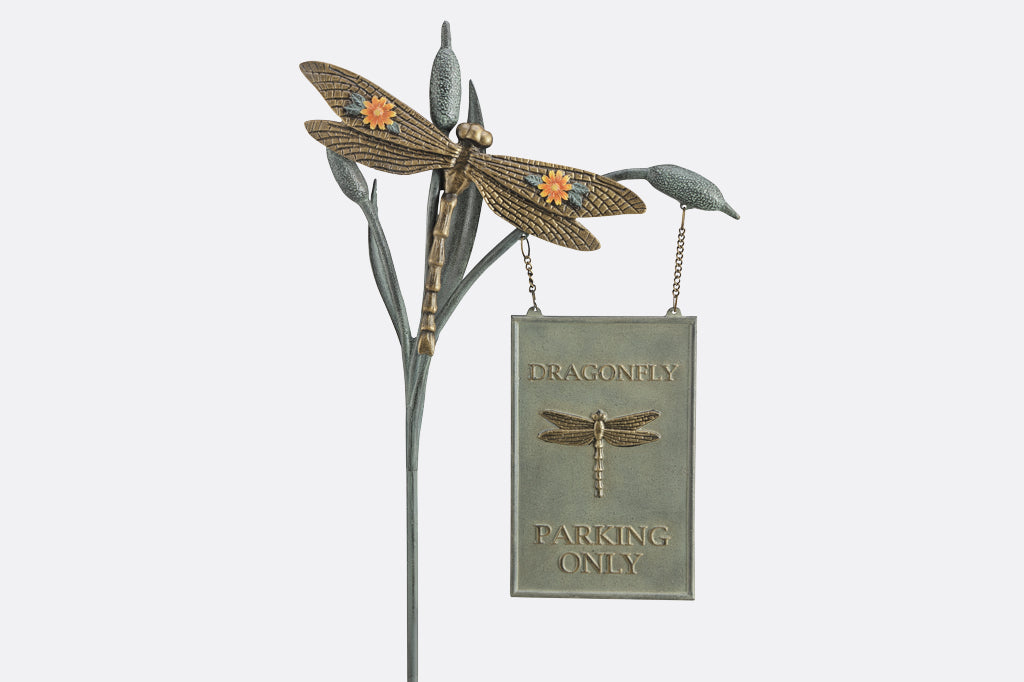 Decorative garden stake with dragonfly design and 'Dragonfly Parking Only' sign on a white background