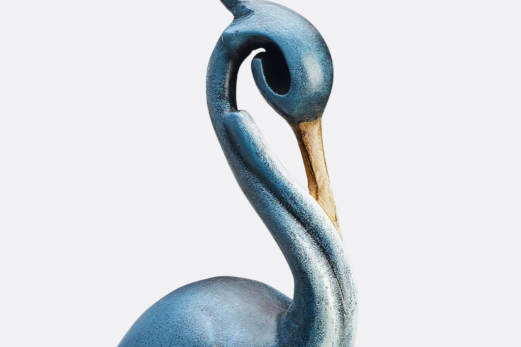 close-up detail of the finish on a heron garden statue