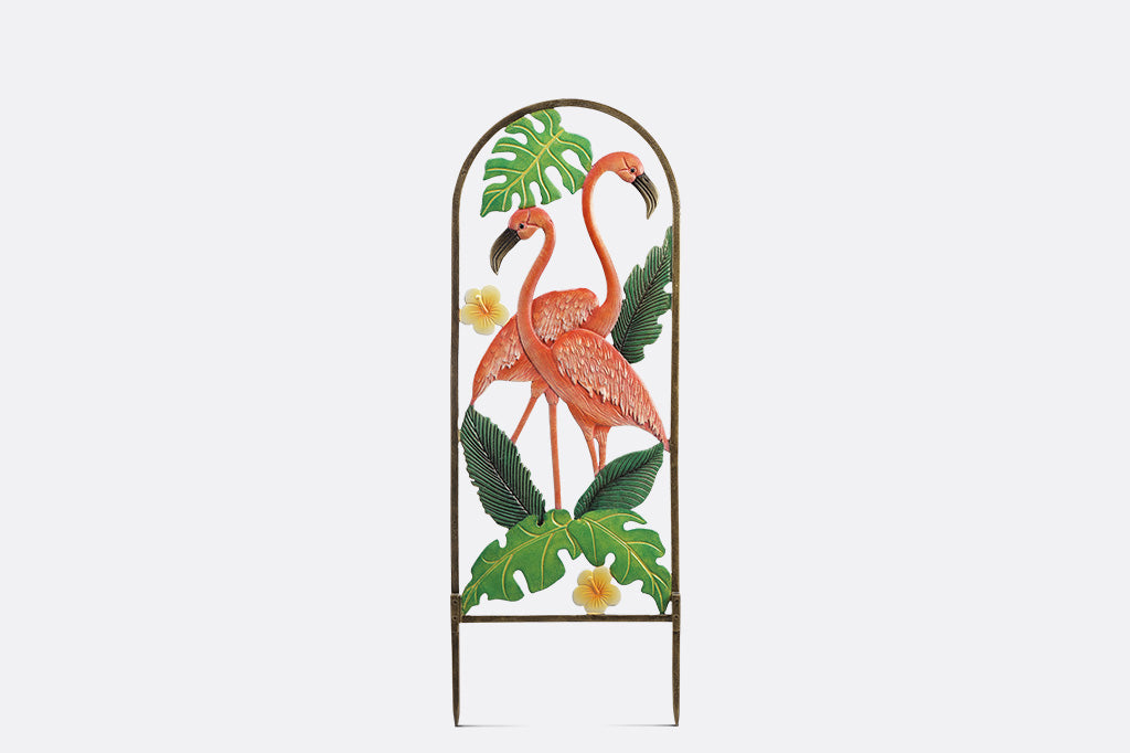 Decorative metal garden art with flamingo design on a white background