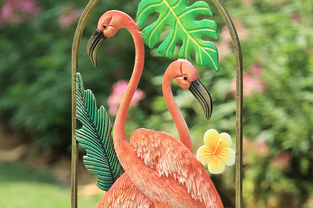 close up detail from the side of the flamingo trellis in a garden setting
