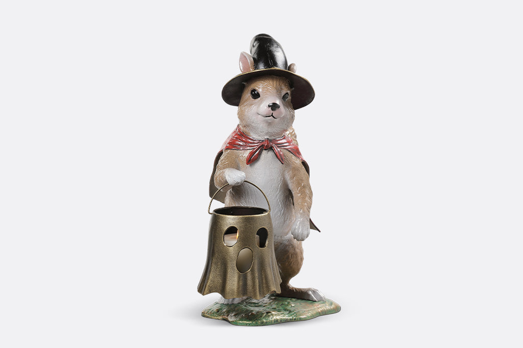Decorative figurine of a rodent wearing a hat and holding a lantern on a white background