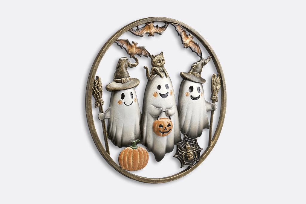 Decorative wall piece with ghosts, pumpkins, and bats on a white background