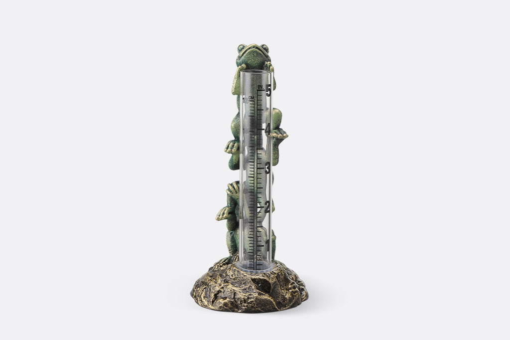 Frog-themed thermometer on a white background